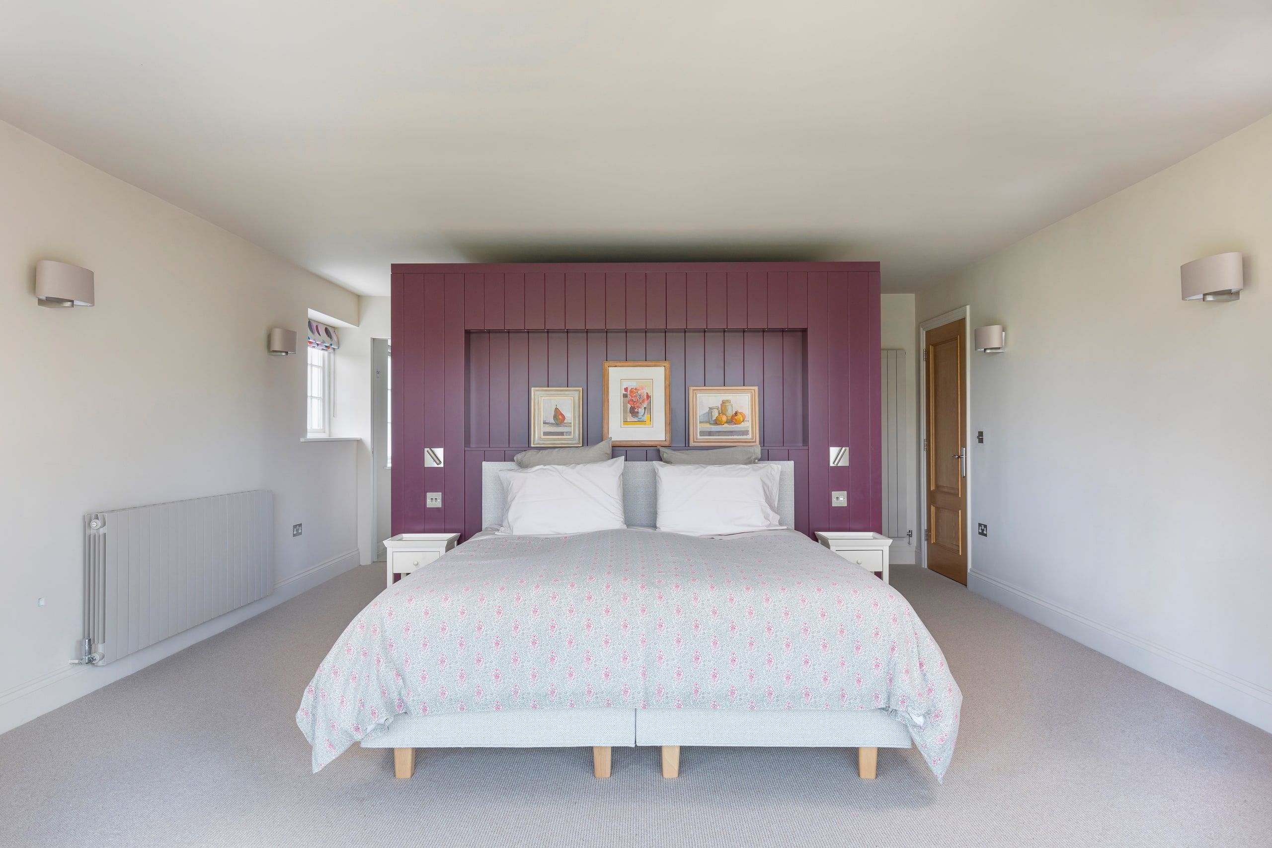 Master bedroom with a panelled headboard wall facing the new bay, detached house, Shackleford.